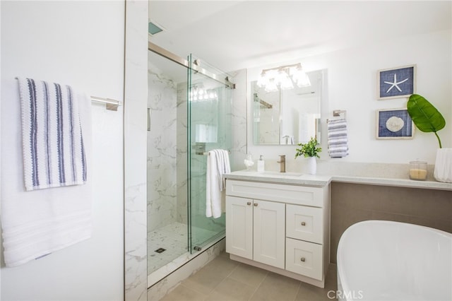 bathroom featuring independent shower and bath, vanity, and tile patterned floors