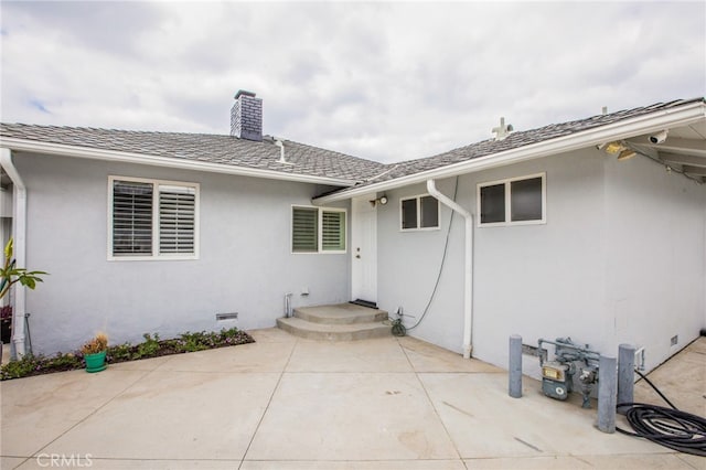 entrance to property featuring a patio area