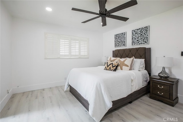 bedroom featuring light hardwood / wood-style flooring and ceiling fan