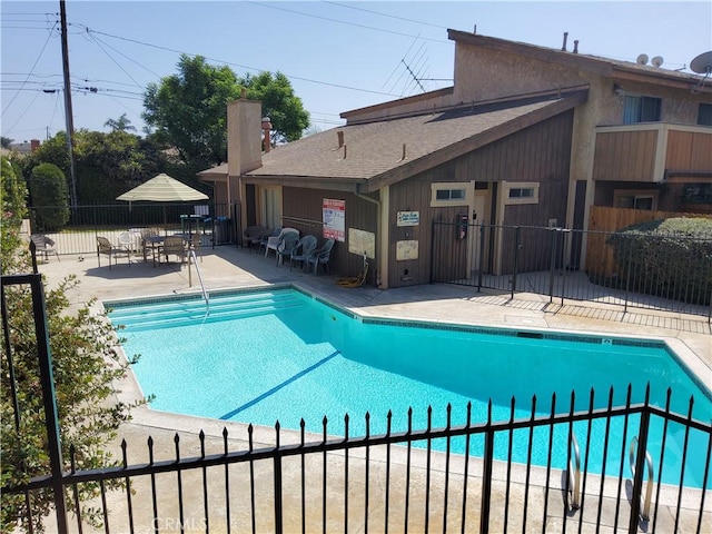 view of swimming pool featuring a patio area