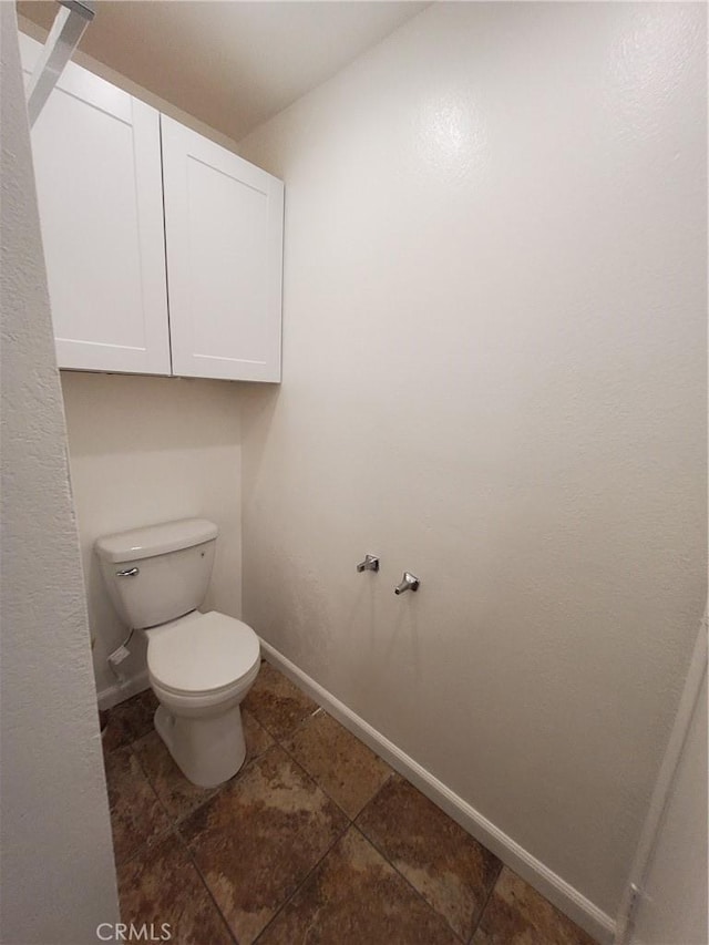 bathroom with tile patterned floors and toilet