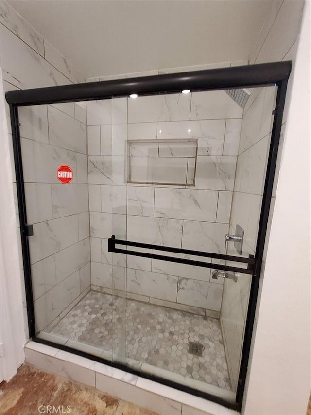 bathroom with an enclosed shower