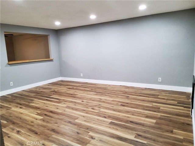 empty room with wood-type flooring