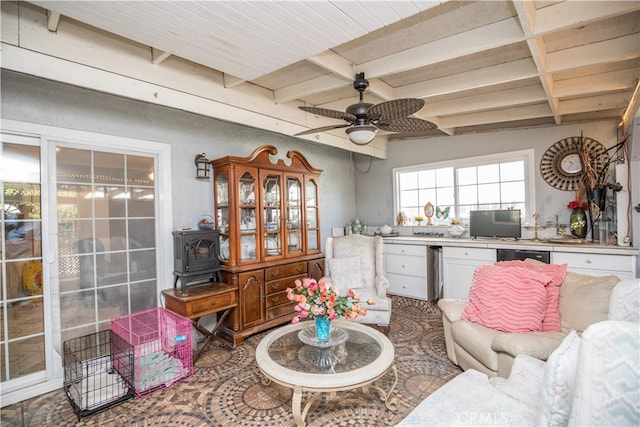 living room featuring beam ceiling and ceiling fan