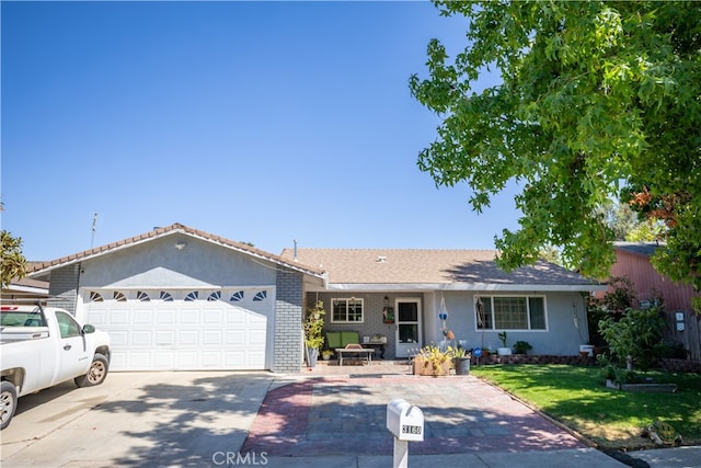 single story home with a front lawn and a garage