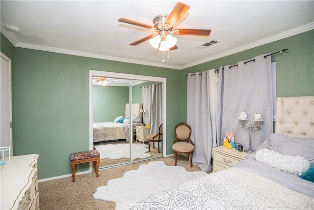 carpeted bedroom featuring a closet, ceiling fan, and crown molding