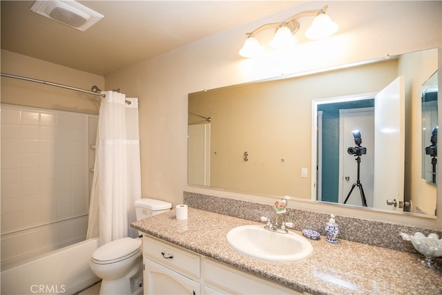 full bathroom featuring vanity, toilet, and shower / bath combo with shower curtain