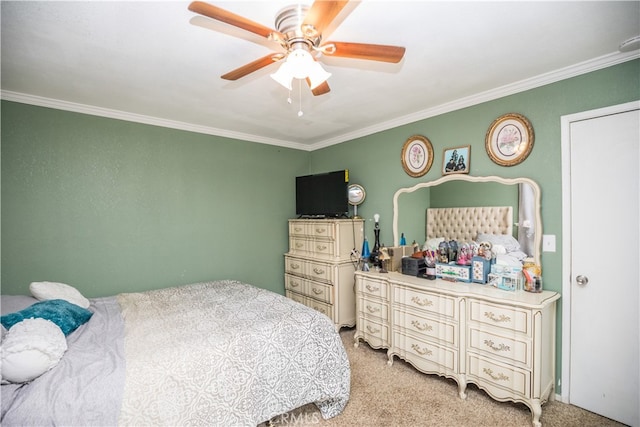 bedroom featuring ornamental molding, ceiling fan, and light colored carpet