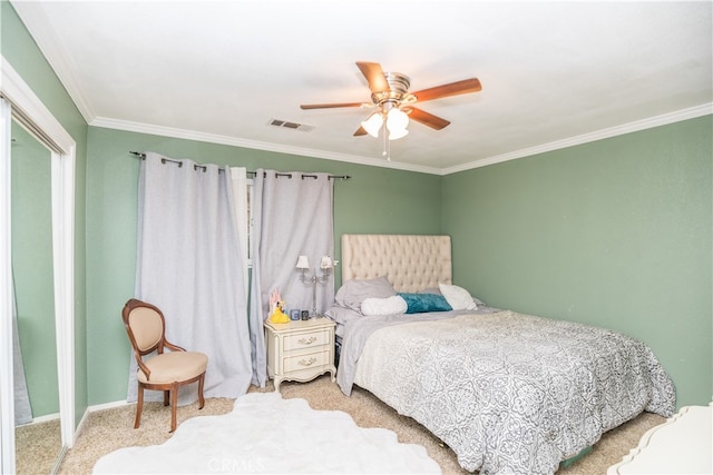 bedroom featuring carpet flooring, ornamental molding, and ceiling fan