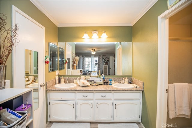 bathroom featuring ceiling fan, vanity, and crown molding