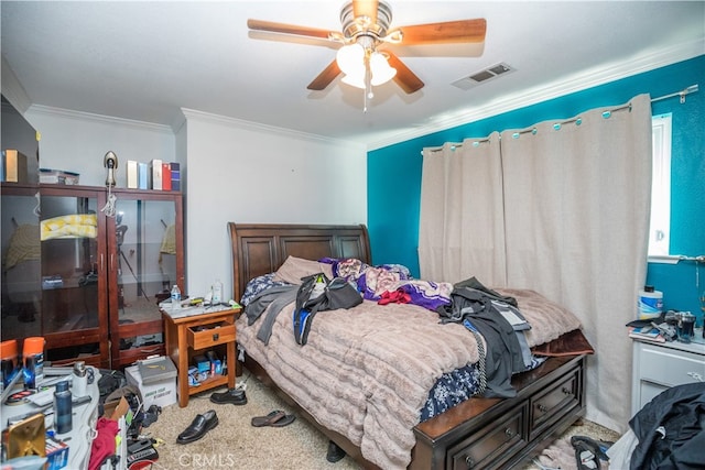 bedroom featuring ceiling fan, carpet floors, and crown molding