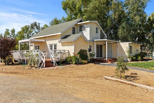 view of front of home with a wooden deck