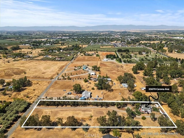 birds eye view of property with a mountain view and a rural view