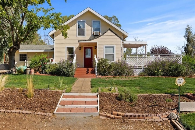 view of front facade with a front lawn and cooling unit