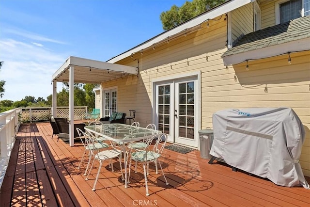 wooden deck featuring area for grilling and french doors