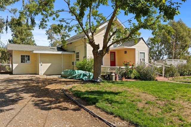 back of house featuring a yard