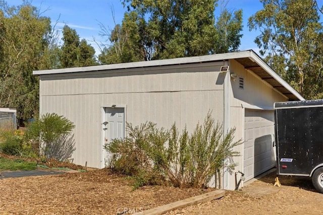 view of outbuilding featuring a garage