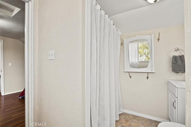 bathroom featuring tile patterned flooring and vanity