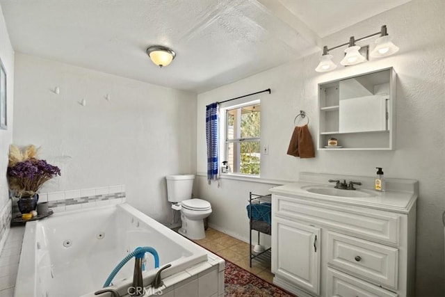 bathroom with tile patterned flooring, a relaxing tiled tub, toilet, and vanity