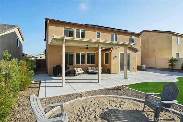 rear view of house with an outdoor living space, ceiling fan, a patio area, and a pergola