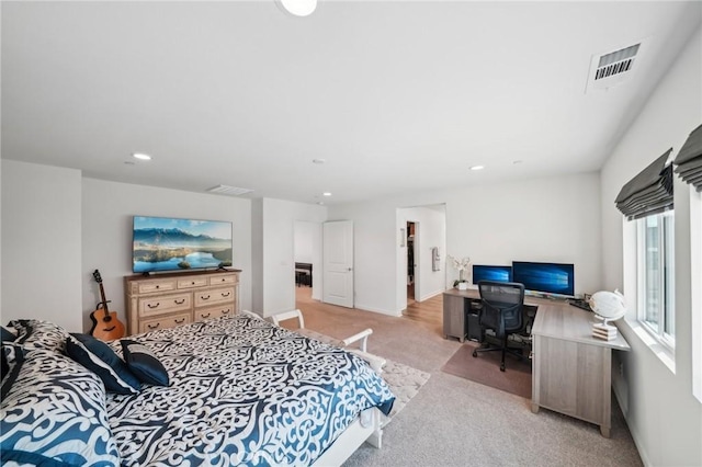 bedroom featuring light carpet