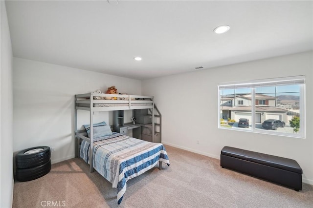 bedroom with light carpet