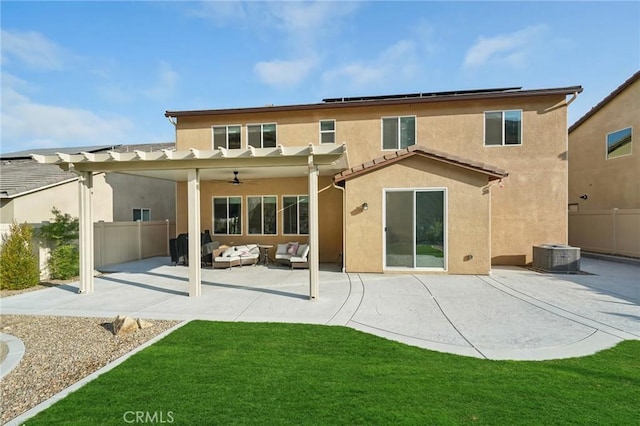 rear view of property featuring a lawn, an outdoor hangout area, ceiling fan, central AC unit, and a patio