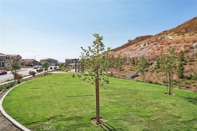 view of property's community featuring a lawn