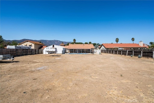 34578 Hickory Ln, Wildomar, CA 92595 - rear view of house featuring a fenced backyard and a mountain view