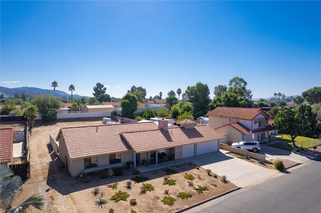 birds eye view of property featuring a mountain view