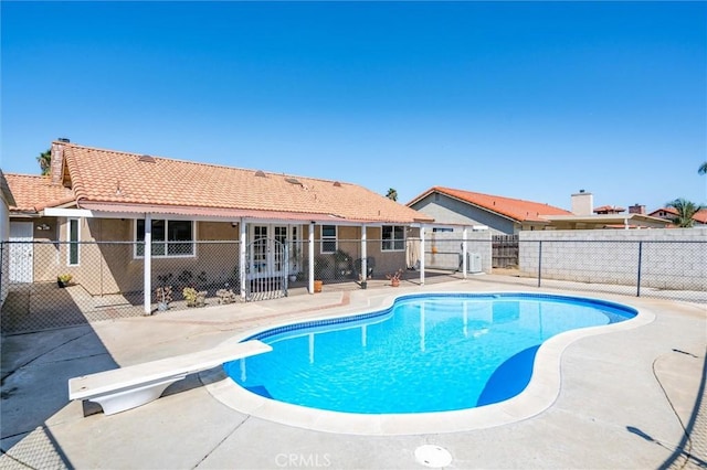 34578 Hickory Ln, Wildomar, CA 92595 - view of swimming pool with a patio, a diving board, and french doors
