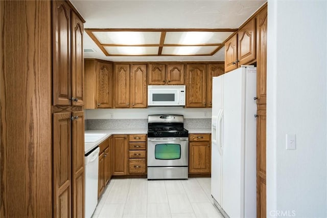 34578 Hickory Ln, Wildomar, CA 92595 - kitchen with white appliances, brown cabinets, and light countertops