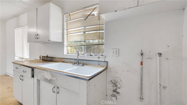 kitchen with white cabinets and sink