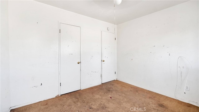 unfurnished bedroom with light carpet