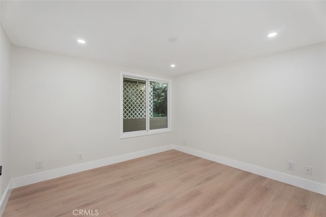 unfurnished room featuring light wood-type flooring