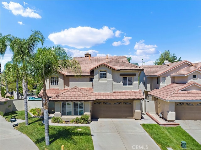 view of front of home featuring a front lawn and a garage