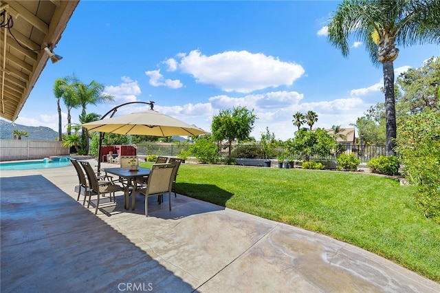 view of patio / terrace with a fenced in pool