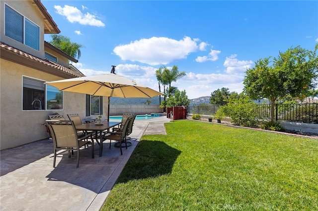 view of yard featuring a patio and a fenced in pool