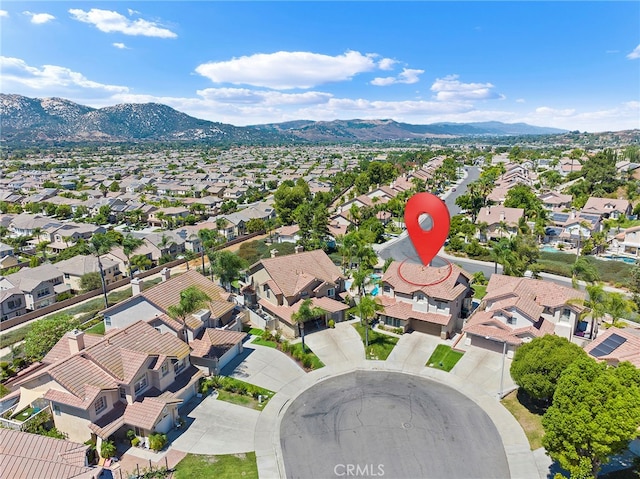 birds eye view of property with a mountain view