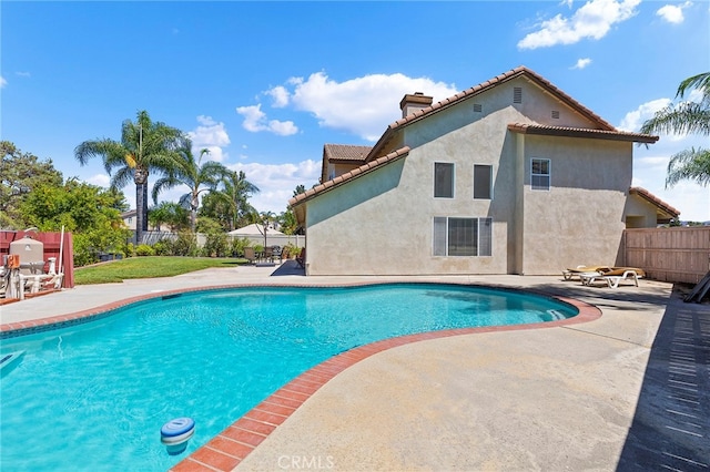 view of pool featuring a patio