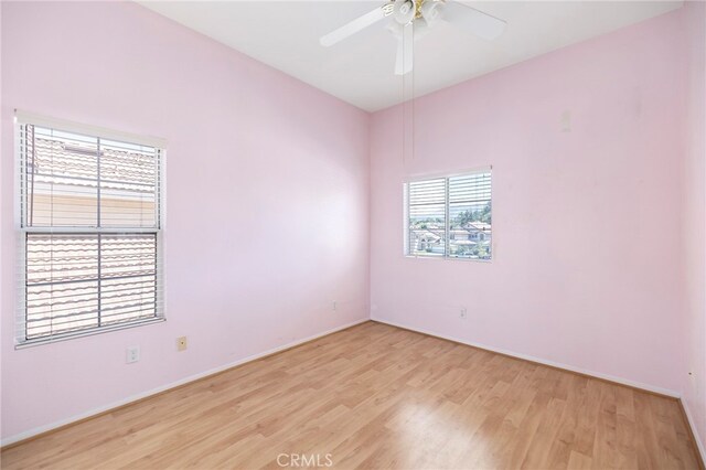 empty room featuring light hardwood / wood-style floors and ceiling fan