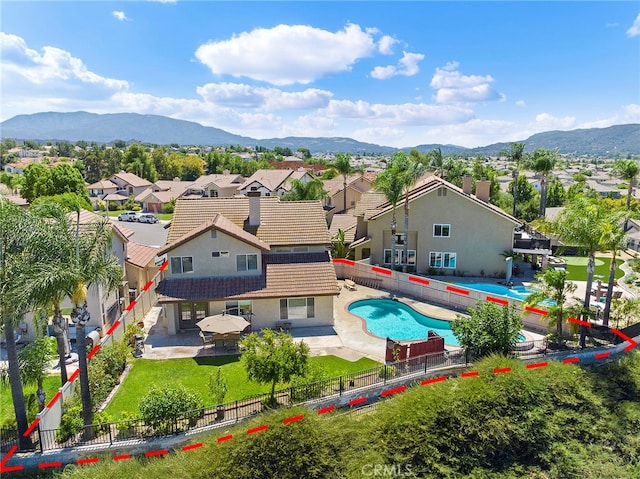 birds eye view of property with a mountain view