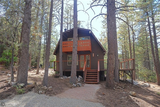 chalet / cabin with a deck and stairs