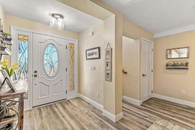 entryway with light hardwood / wood-style floors