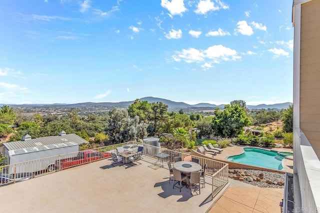 exterior space featuring a mountain view and a patio area