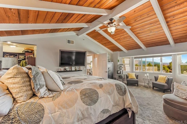 carpeted bedroom with vaulted ceiling with beams, ceiling fan, and wood ceiling