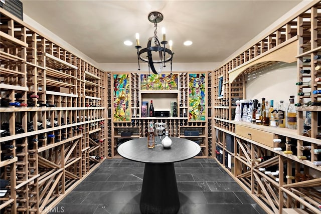 wine area with an inviting chandelier