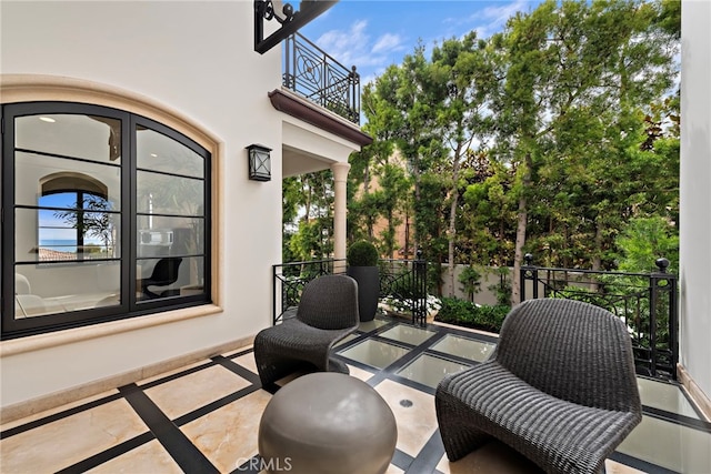 view of patio with a balcony