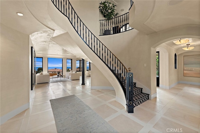 stairway with tile patterned floors