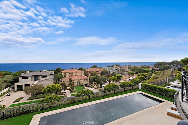 view of pool with a water view